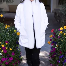 This white reversible mink coat with fox trim combines style and adaptability. The reversible design lets you switch between looks effortlessly. The soft white mink fur radiates elegance and warmth. The fox trim adds a touch of sophistication. As a result, this coat becomes a perfect choice for any occasion.