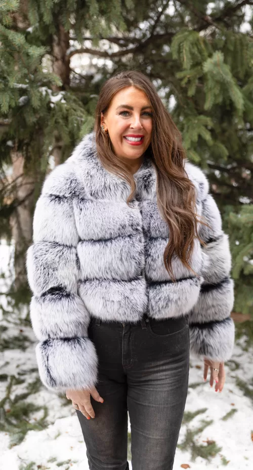 Our black with white tip fox jacket exudes striking elegance and unique style in every detail. The deep black fur contrasts beautifully with the white-tipped accents. Moreover, the jacket adds a bold, luxurious statement to any outfit. You will turn heads wherever you go.