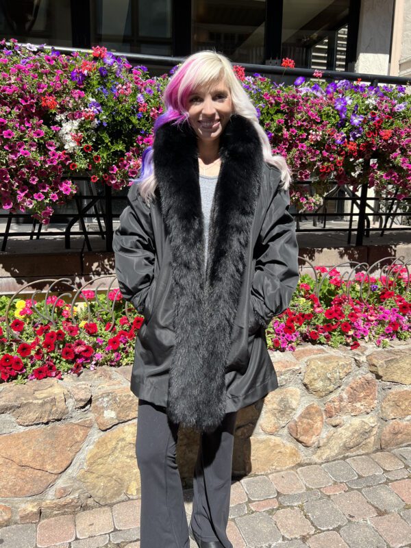 Our reversible dyed black ranch mink coat with dyed black fox tuxedo trim is versatile and luxe. This elegant coat features soft mink fur, providing a...