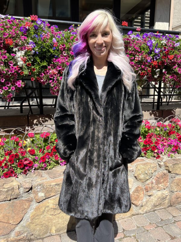 This natural Blackglama mink stroller is luxe and timeless. Blackglama mink is regarded for its deep black color and dense soft fur - making it desirable in high end fashion. This stroller length coat is warm and versatile for any occasion.