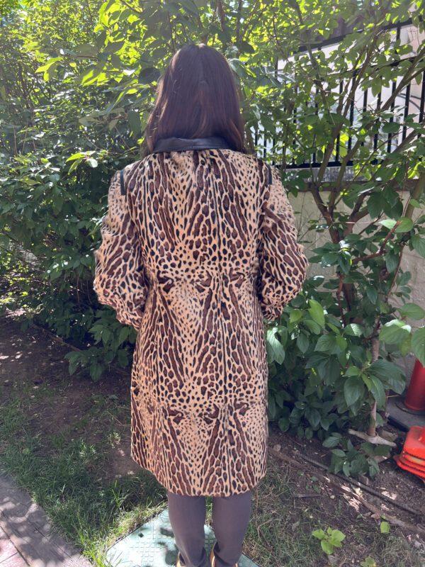 Our dyed animal print goat skin stoller length coat has an eye catching animal print. The stroller length makes it versatile and comfortable. This...