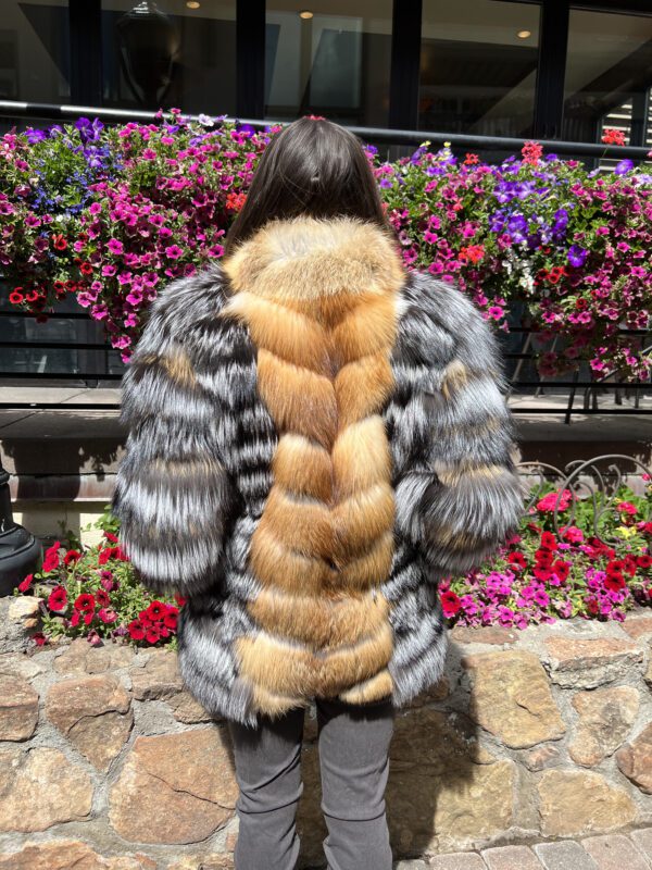 Our natural silver and red fox jacket is a blend of elegance and visual appeal. This piece combines the soft, dense fur of silver fox with the vibrant...