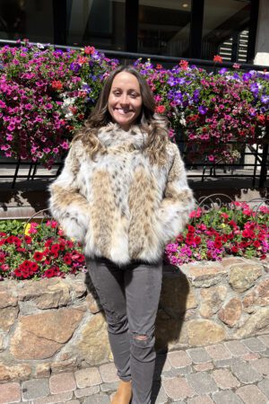Ideal for those seeking a blend of elegance and practicality. This plush American Lynx Jacket with a hood is perfect for adding luxury to winter attire.