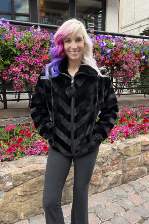 Our zip-up dyed black sheared ranch mink jacket combines luxury with simplicity. This jacket has a sleek look and a comfortable fit, suitable for both...