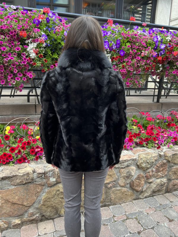 Our mink jacket with a fox collar combines elegance with luxury. This jacket is soft and warm, with a natural sheen. Ideal for various occasions...