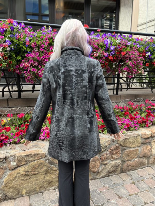 This women's grey Swakara jacket is luxe and beautiful. This fur is known for being soft and dense, and has a distinctive curl pattern. It is warm...