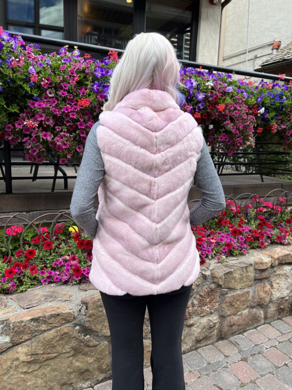 Made from luxurious dyed pink rabbit fur, this reversible vest combines comfort and style. It is perfect for adding a pop of fun to any outfit...