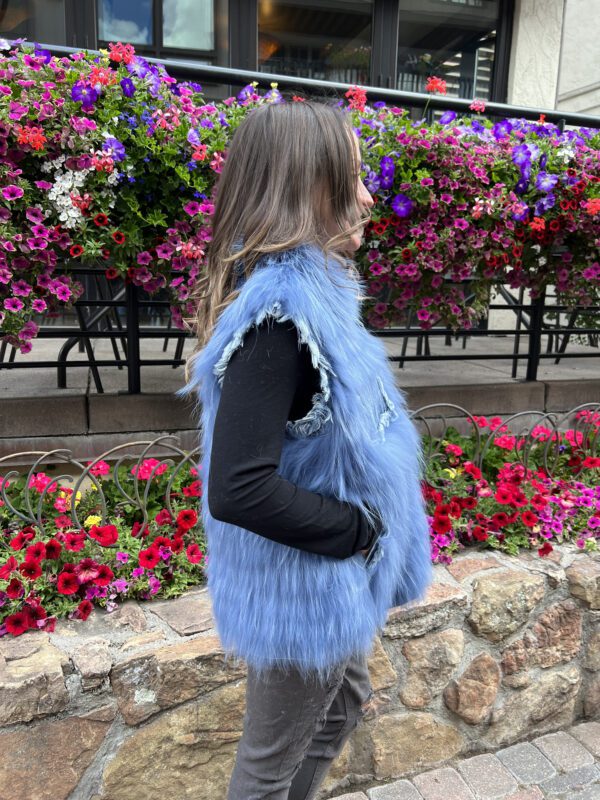 This dyed finn raccoon and denim vest is chic and unique. It has a blend of rustic charm and luxury. The fur adds a lavish touch, offering contrast in...