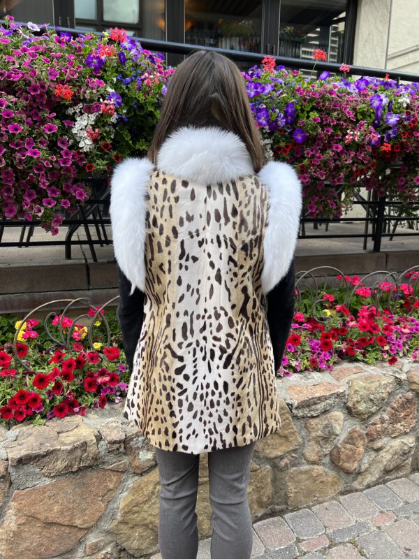 Our dyed animal print goat skin vest with white fox fur trim has a wild allure and luxe softness. Ideal for those who appreciate unique style and the...