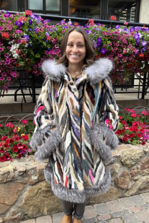 Our hooded multi-colored mink coat and natural silver fox trim is a masterpiece of luxury and style. This coat showcases a vibrant palette of mink fur...