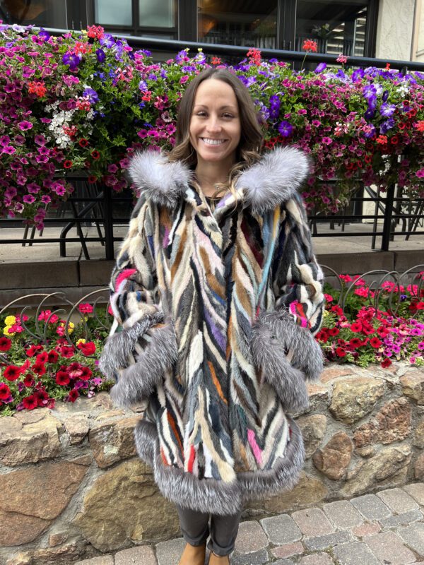 Our hooded multi-colored mink coat and natural silver fox trim is a masterpiece of luxury and style. This coat showcases a vibrant palette of mink fur...