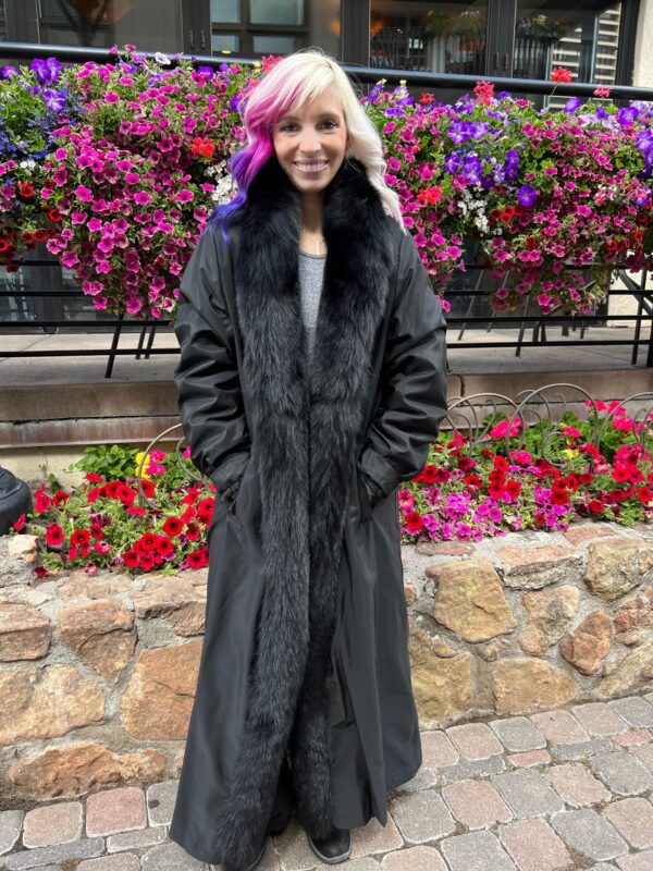 Our full length reversible black mink coat with black fox tuxedo trim is luxe and timeless. The versatility of this coat allows for a transition from luxury to a more subdued elegance. It's a perfect choice for both formal events and casual outings.