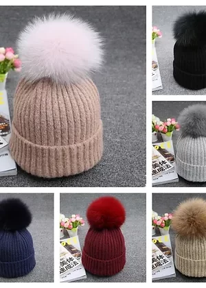 Our cashmere blend hats with fox poms combine luxurious warmth with sophisticated style. Made from a soft cashmere blend, these hats are comfortable...