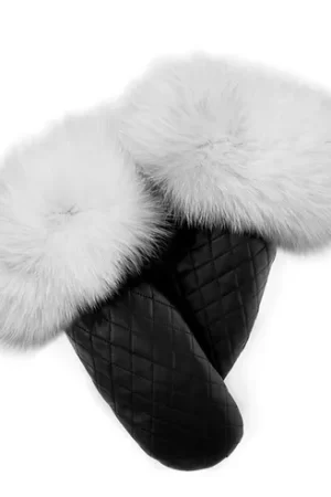Our quilted black leather mittens with white fox trim blend style with warmth. Made from quilted black leather, these mittens are durable and offer a...